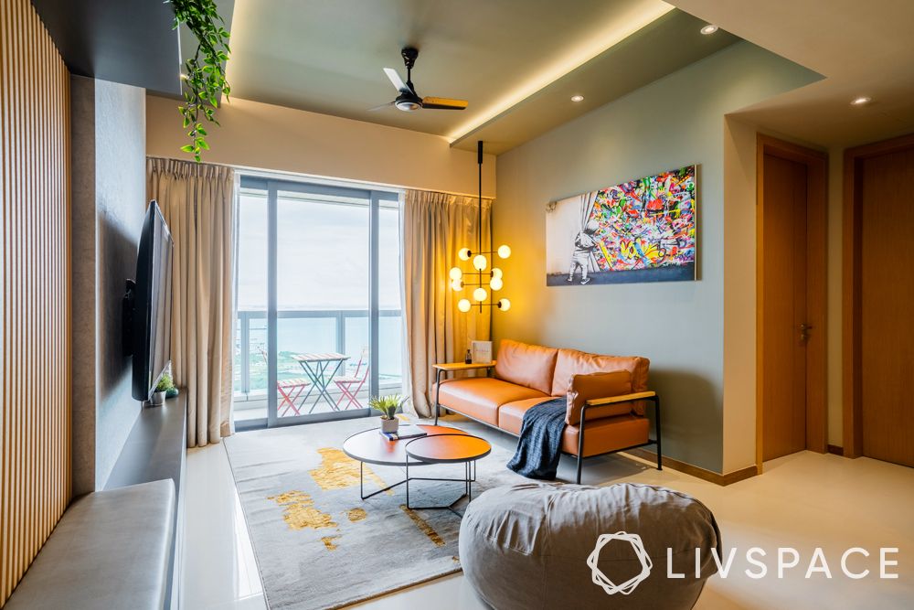 small-living-room-hanging-lights-orange-sofa-balcony-chairs-bean-bag
