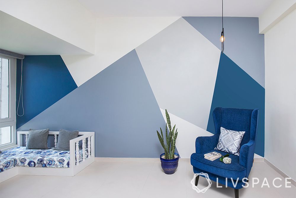 blue-shade-geometric-accent-wall-blue-armchair