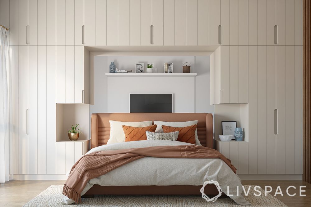 white-concealed-wardrobe-unit-peach-headboard 