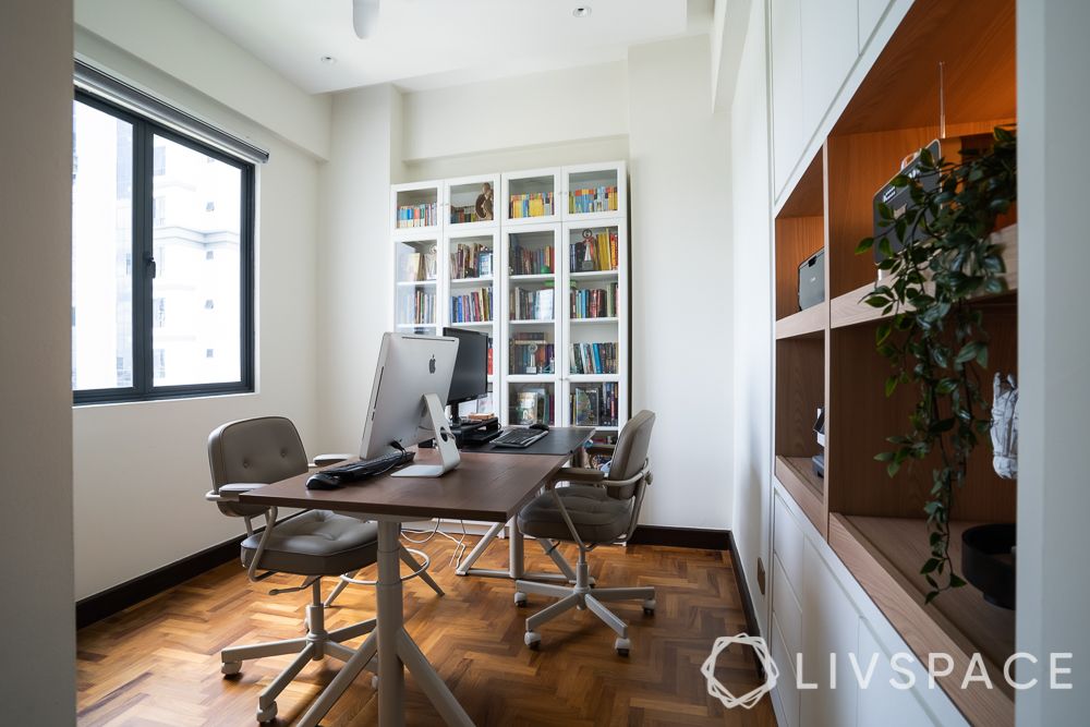 roller-chair-study-table-white-bookcase-parquet-floor