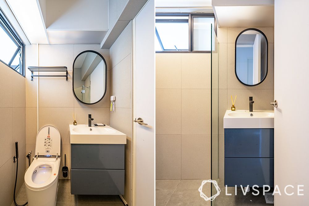 white-bathroom-tiles-blue-floating-vanity-oval-mirror