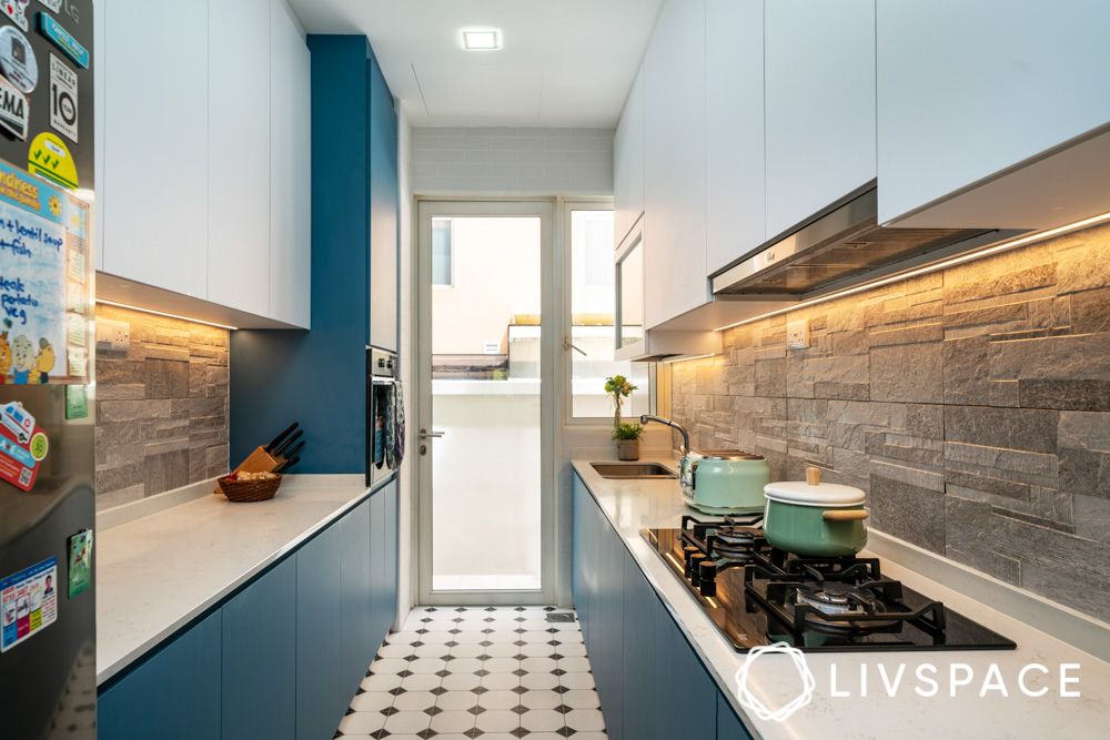 stone-cladded-kitchen-backsplash-with-blue-and-white-cabinets