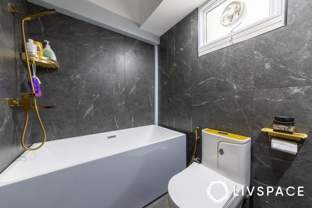 gold-accent-bathroom-fittings-with-marble-walls
