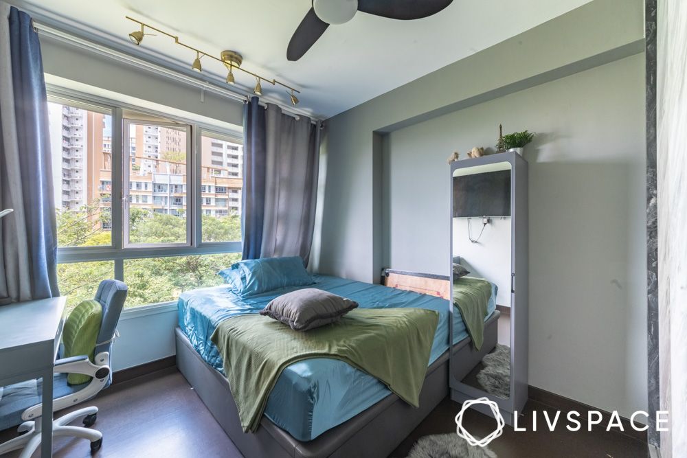 secondary-bedroom-with-satin-bedding-and-gilded-accent-lights