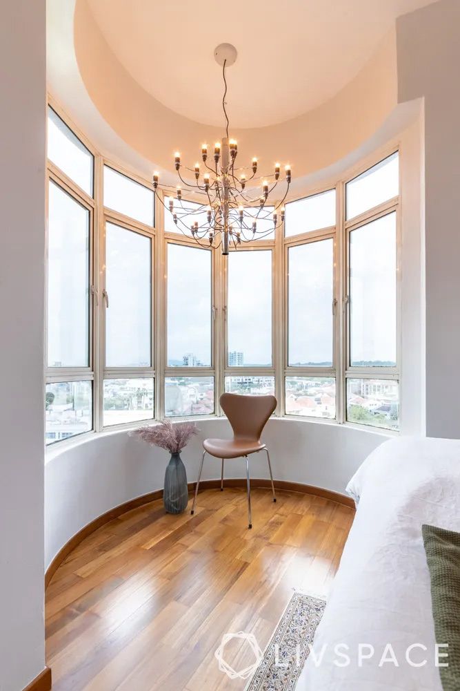 condominium-design-with-reading-corner-and-gino-sarfatti-chandelier