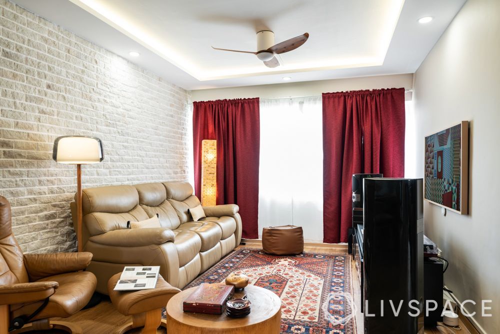 false-ceiling-design-in-living-room-with-brick-accent-wall