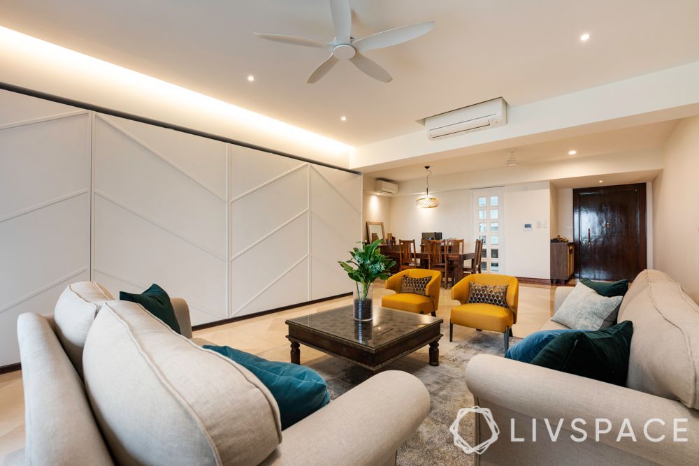 false-ceiling-with-cove-and-recessed-lights-in-living-room