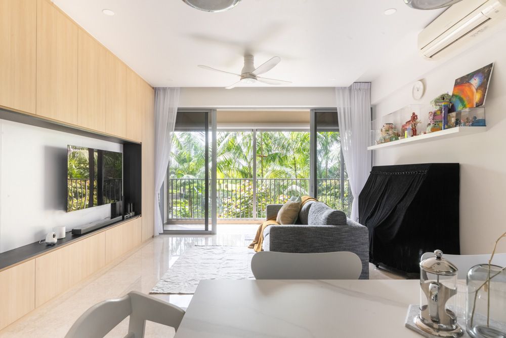 living-room-with-balcony-at-rivertrees-residences-condo