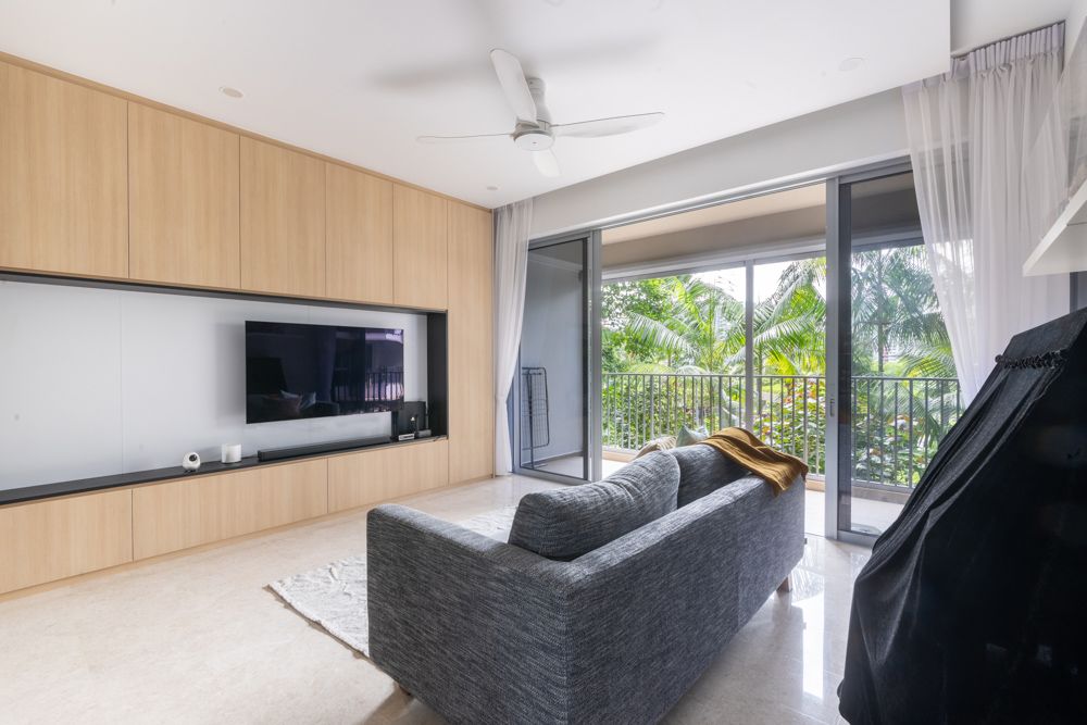 wall-to-wall-light-wood-tv-unit-in-condo-living-room