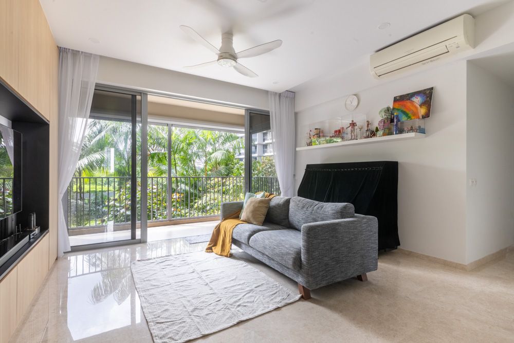 open-balcony-and-living-room-with-grey-sofa-in-rivertrees-residences