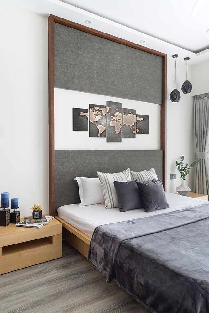 grey-and-white-bedroom-with-headboard-and-artwork