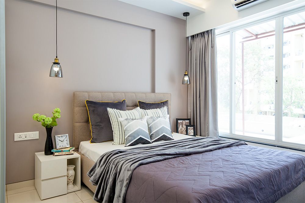 bedroom-with-grey-wall-and-headboard-pendant-lights