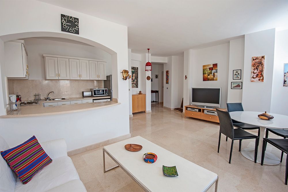 d-shaped-window-between-kitchen-and-living-room