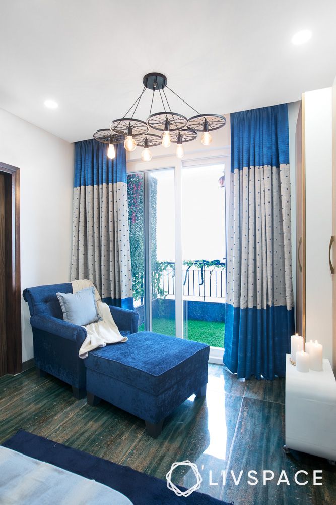 blue-blinds-curtains-singapore-in-living-room-with-blue-sofa-chandelier